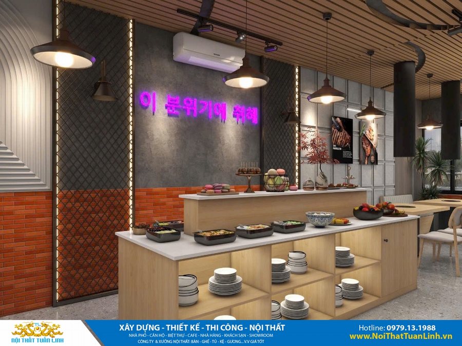 Thiết kế khu buffet nhà hàng với bàn trung tâm trưng bày món ăn, đèn LED chữ Hàn màu hồng, tường bê tông, gạch đỏ, panel 3D, trần gỗ lam, mang phong cách hiện đại và ấn tượng.