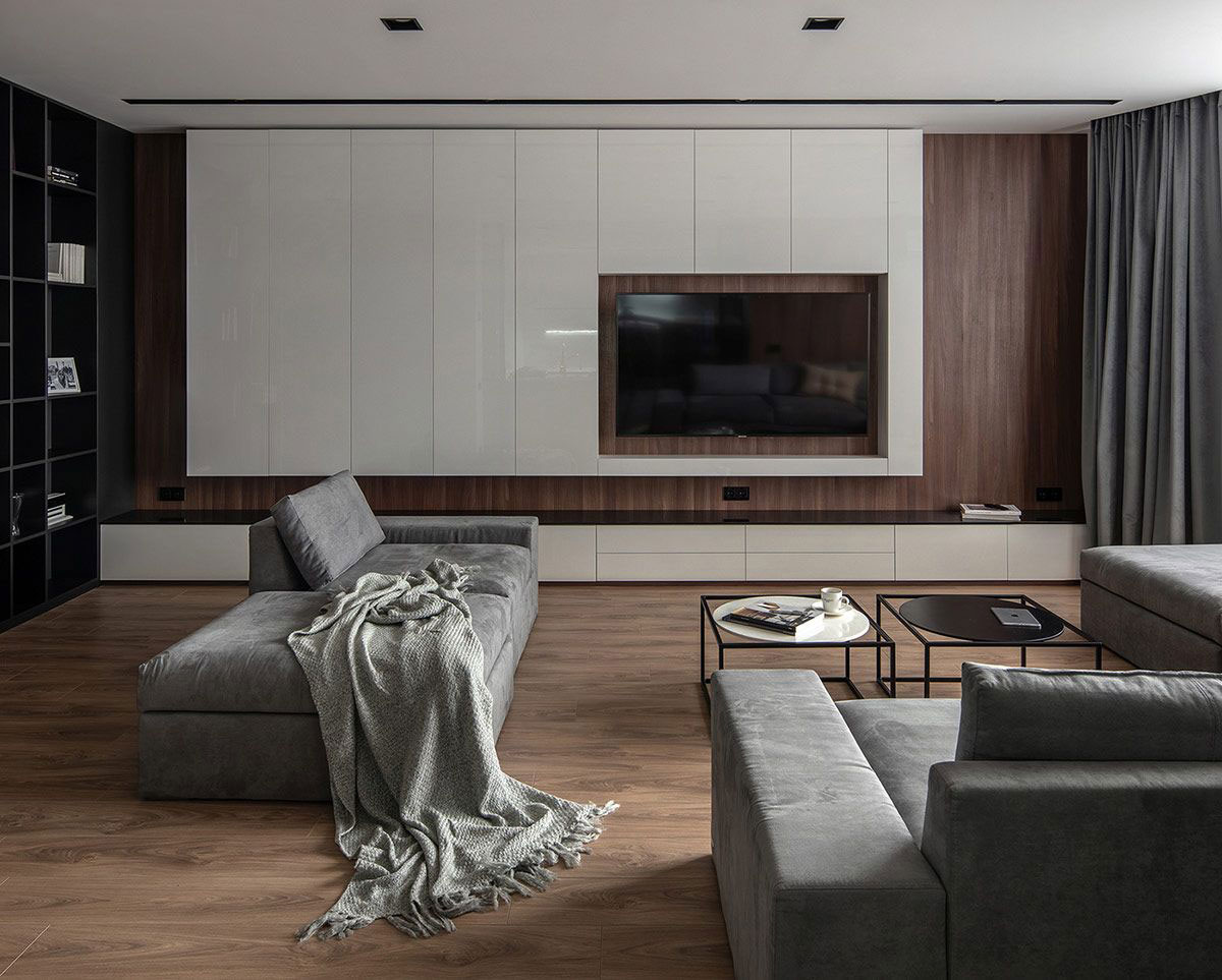 Phòng khách sử dụng sàn gỗ, tường ốp gỗ và ghế sofa nỉ mang đến sự phối kết hợp hài hòa. 1
